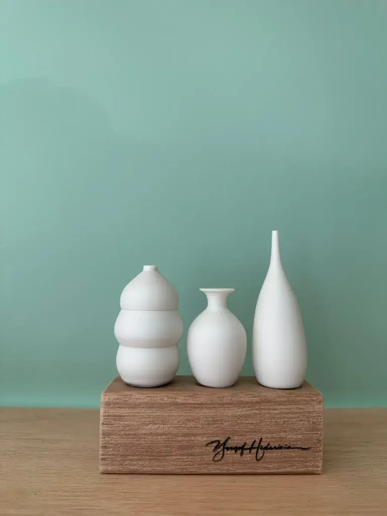 3 porcelain mini vases on a row